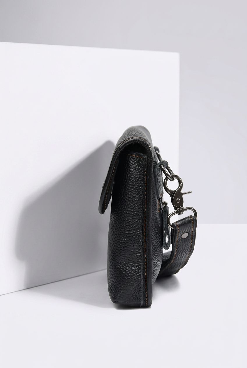 AetherCarry leather crossbody bag detail shot on white background