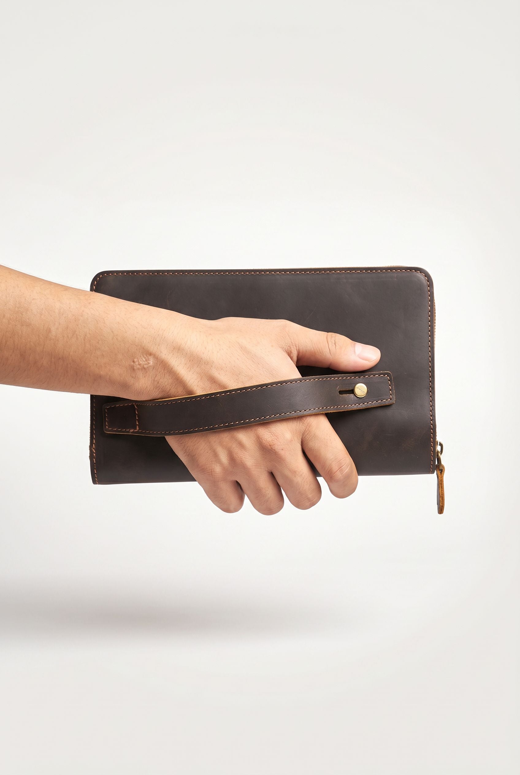 Detail of the genuine leather texture on the vintage clutch wallet