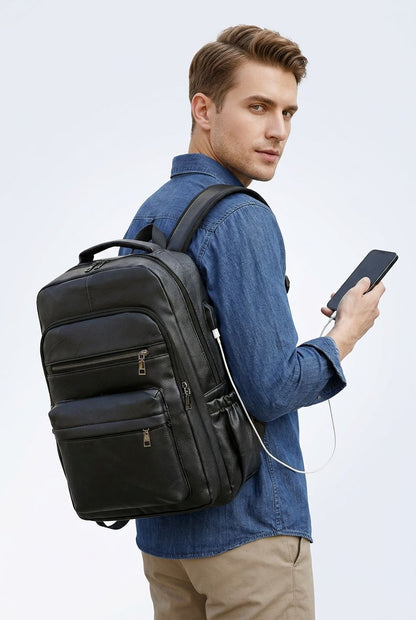 Male model wearing NordEdge leather crossbody bag dark brown