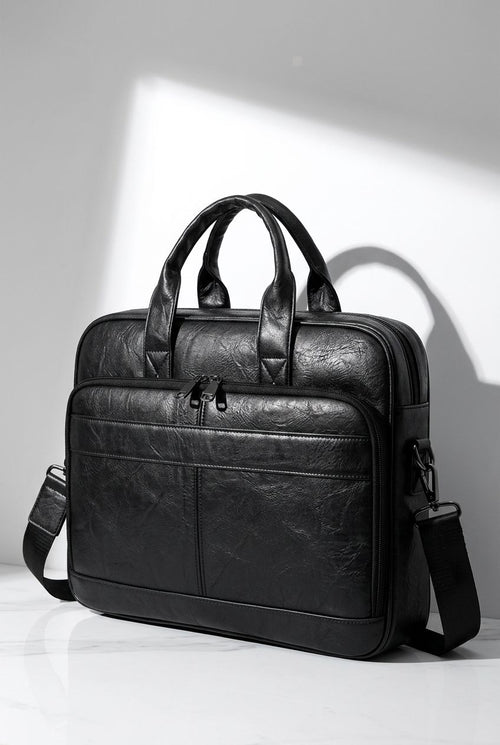 Black leather briefcase Aethel front view with shoulder strap