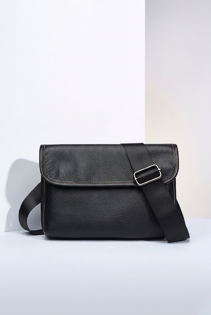 AetherCarry leather crossbody bag side view on white background