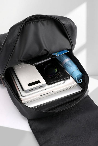 Dedicated laptop compartment inside the men's large PU leather backpack, offering secure and padded protection.