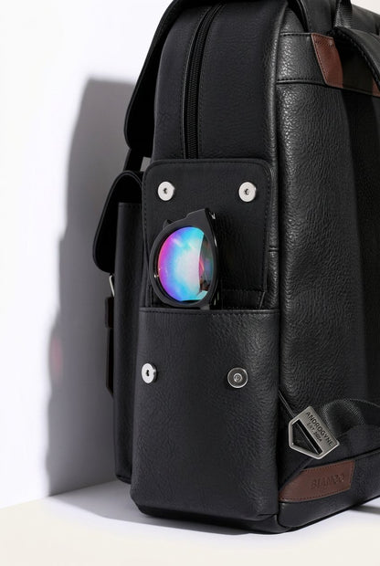 Lifestyle shot of a man wearing the stylish PU leather laptop backpack, ideal for urban commutes and travel.