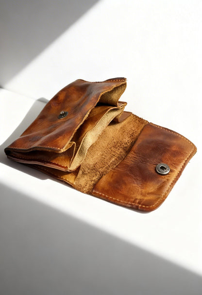 Lifestyle shot of a man using the slim credit card case and coin purse