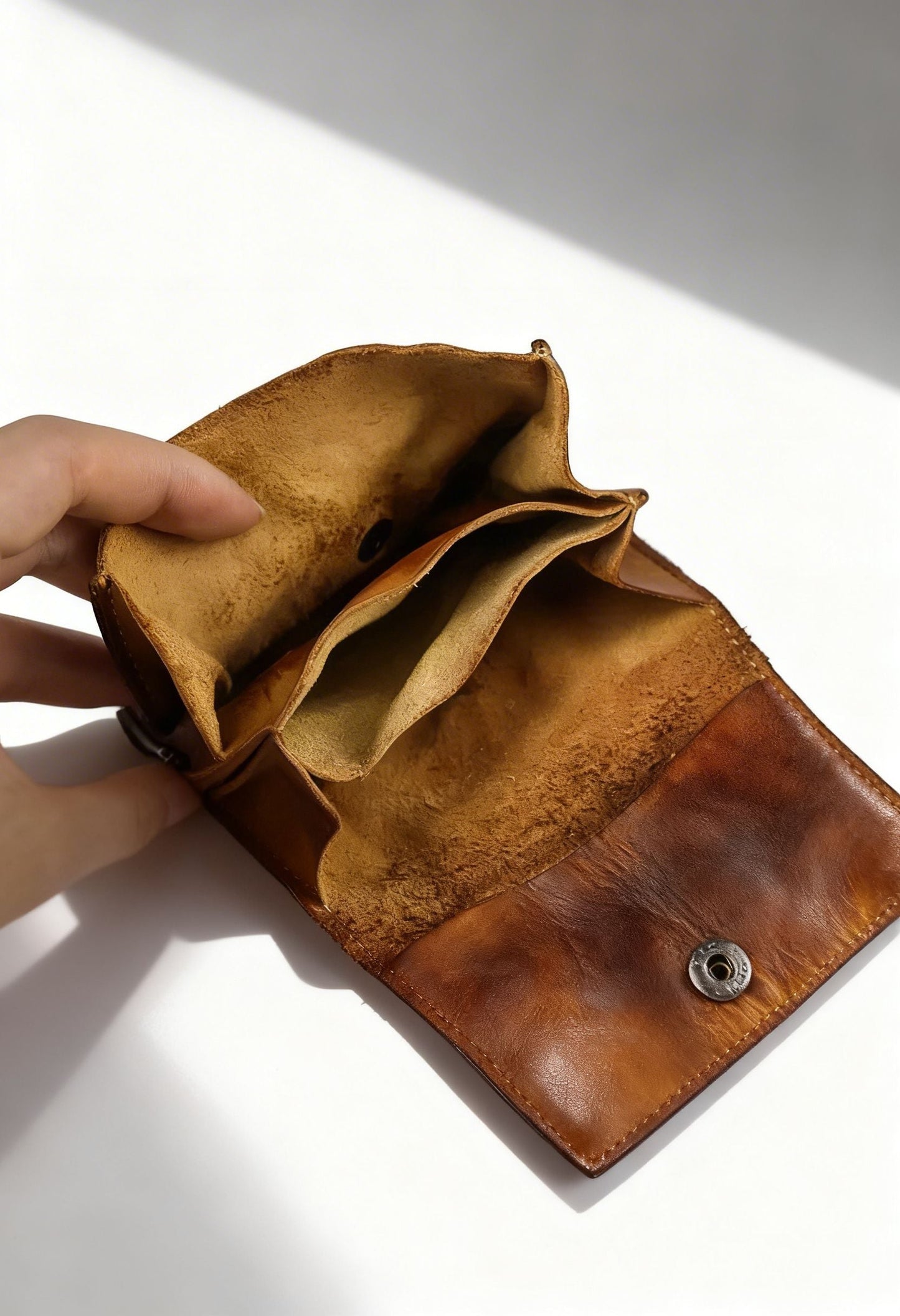 Interior view showing credit card slots and coin compartment of the leather wallet