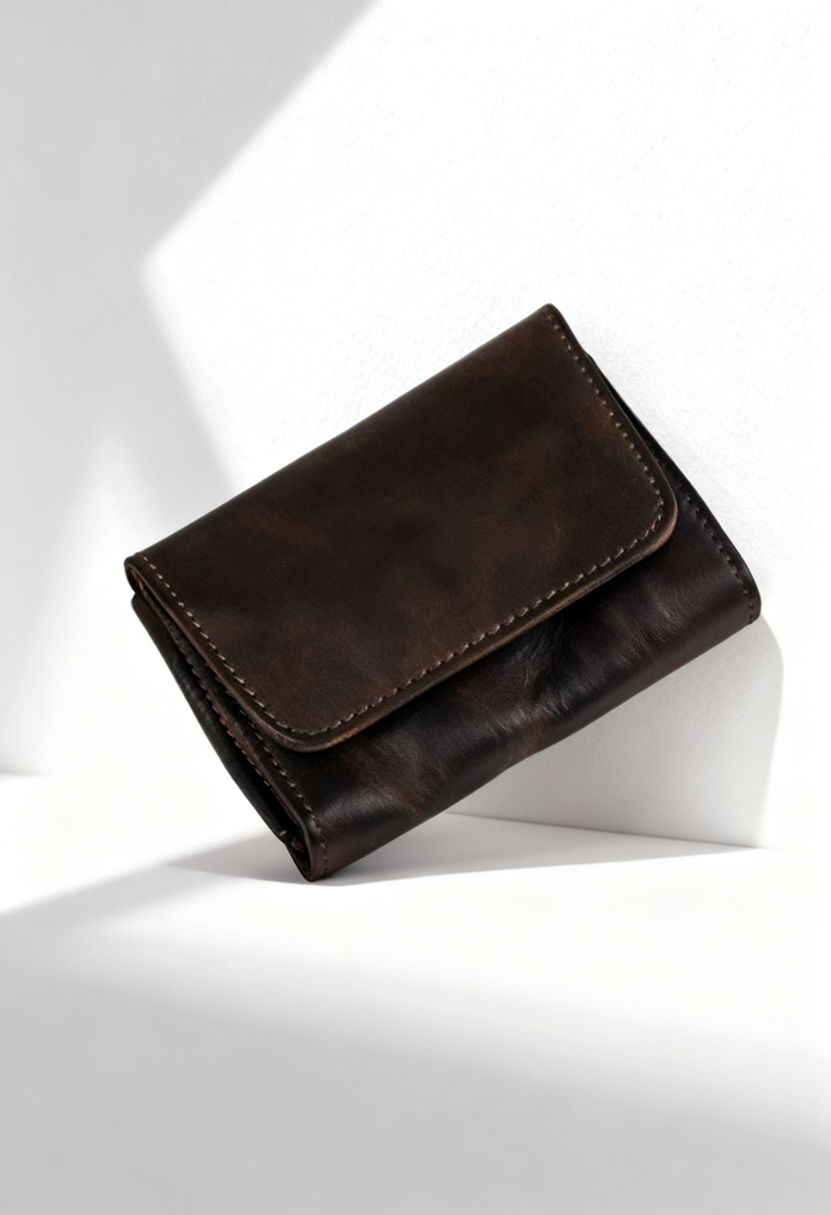 Detailed view of the handcrafted stitching and genuine leather texture of the wallet